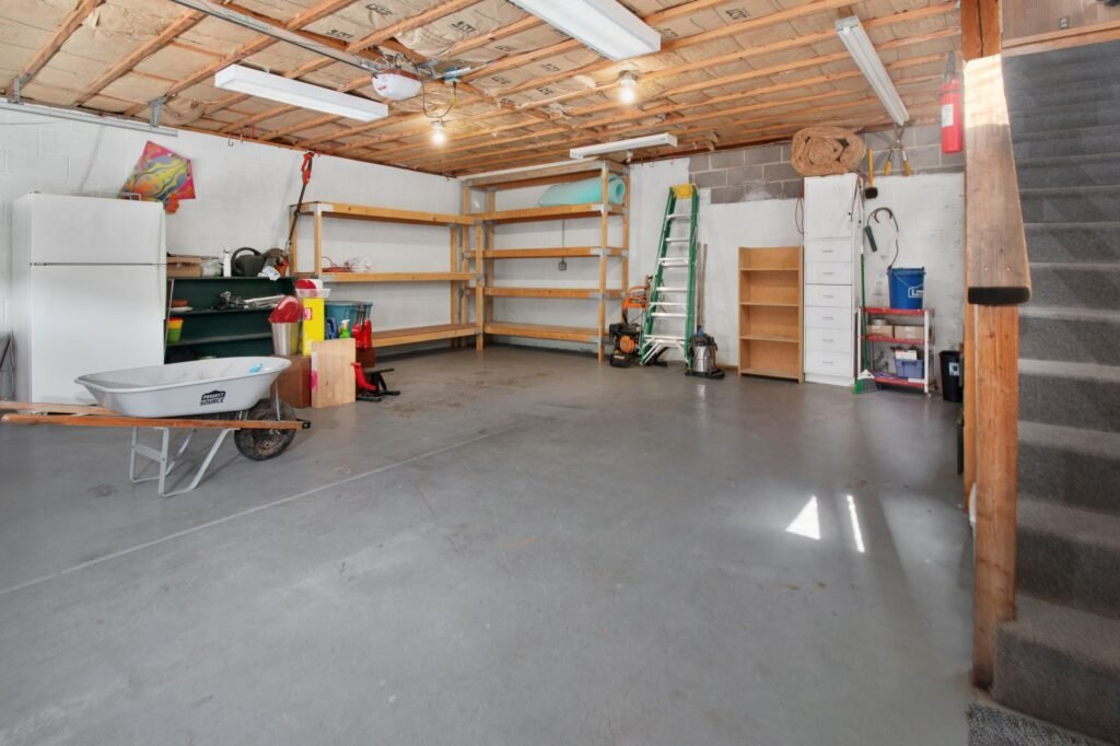 Garage interior with storage shelves and tools
