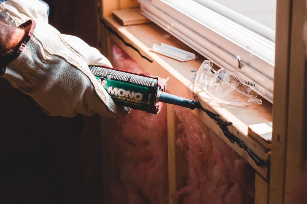 Sealing a gap with caulk to keep rodents out